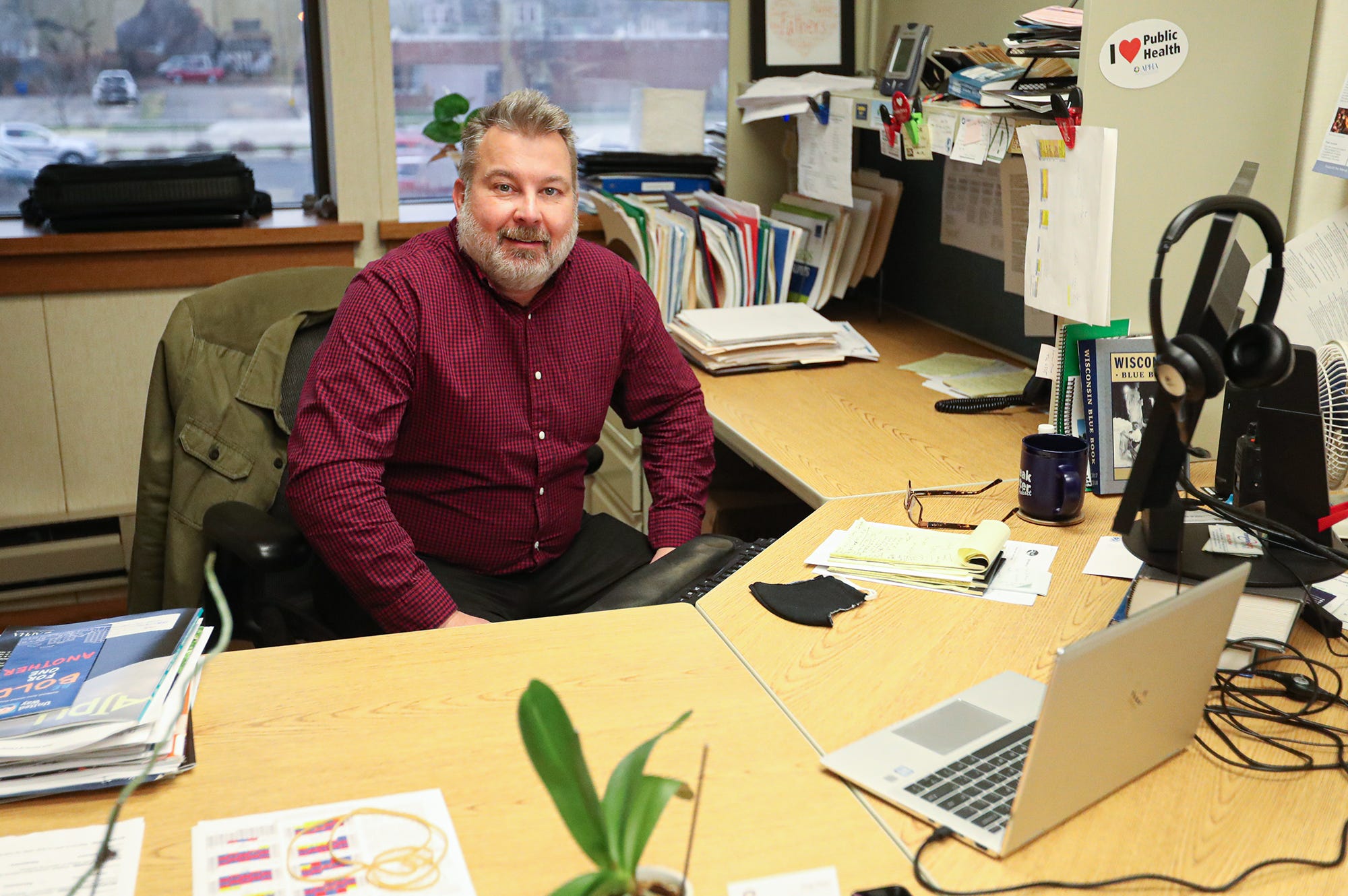 Winnebago County health officer Doug Gieryn works at his desk Wednesday, Nov. 25, 2020, at the Winnebago County Public Health building at 112 Otter St. in Oshkosh, Wis.