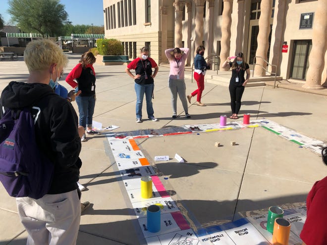Peoria Flex Academy students play a giant game of Monopoly outdoors on Nov. 18, 2020.