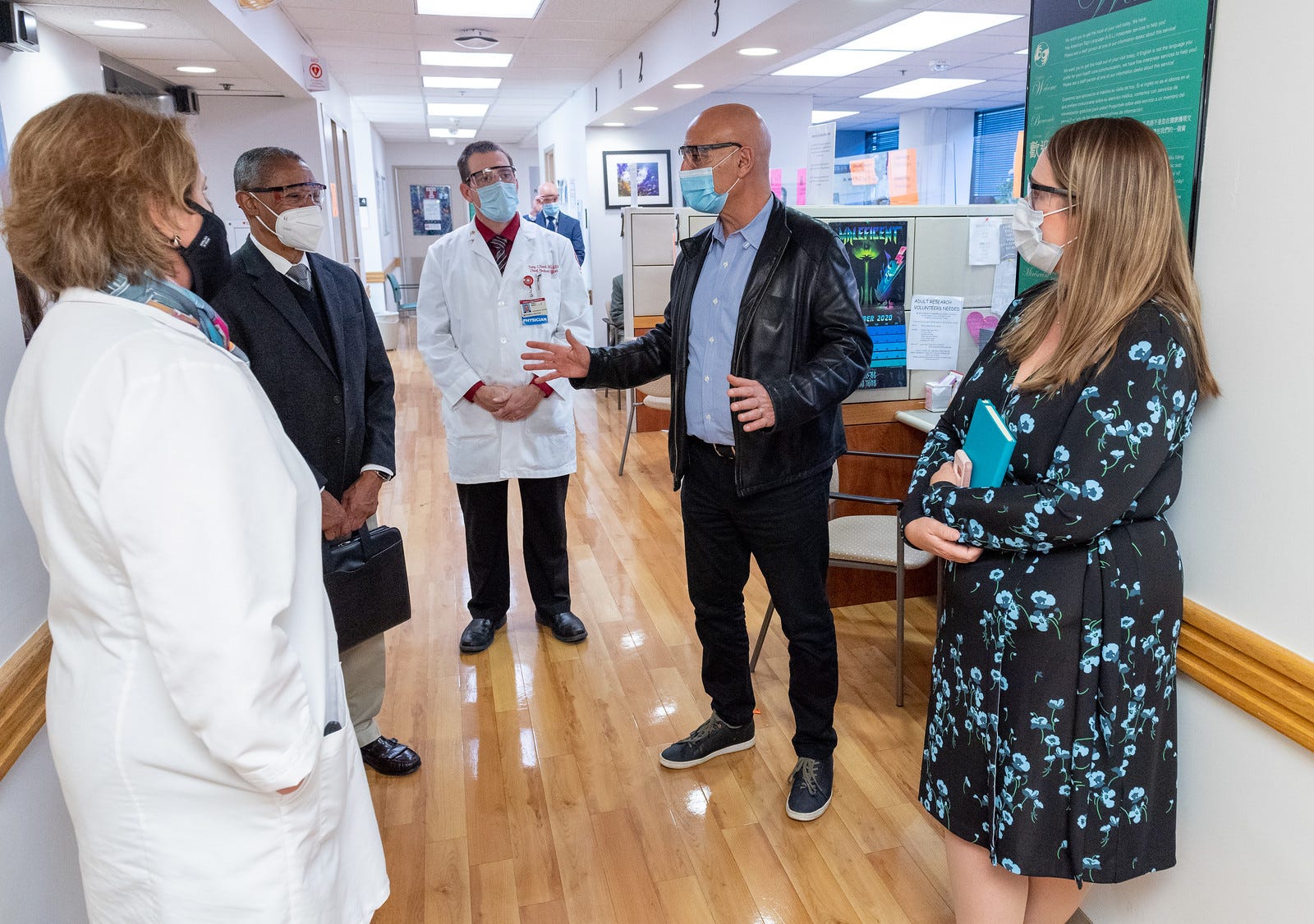 Moncef Slaoui, in leather jacket, tours Temple University Hospital on Nov. 20. Getting a diverse group of clinical trial participants has been  part of his work helping to lead the U.S. COVID-19 vaccine effort.