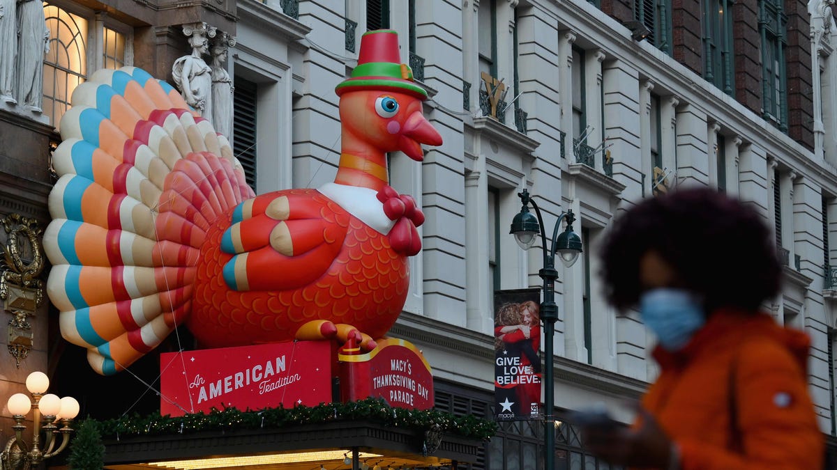 People take photos of Thanksgiving turkey decorations at Macy's Herald Square store on November 24, 2020 in New York City.