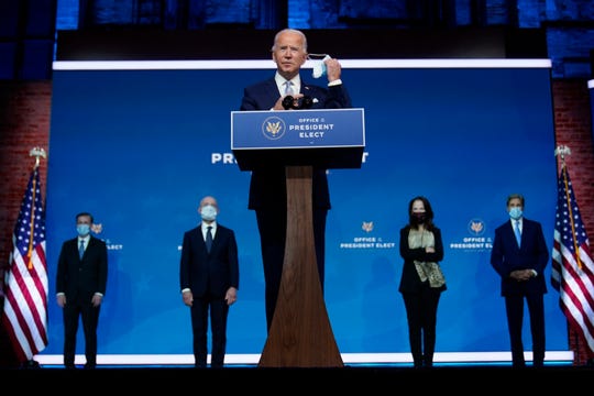 President-elect Joe Biden removes his face mask as he arrives to introduce his nominees and appointees to key national security and foreign policy posts at The Queen theater, Tuesday, Nov. 24, 2020, in Wilmington, Delaware.
