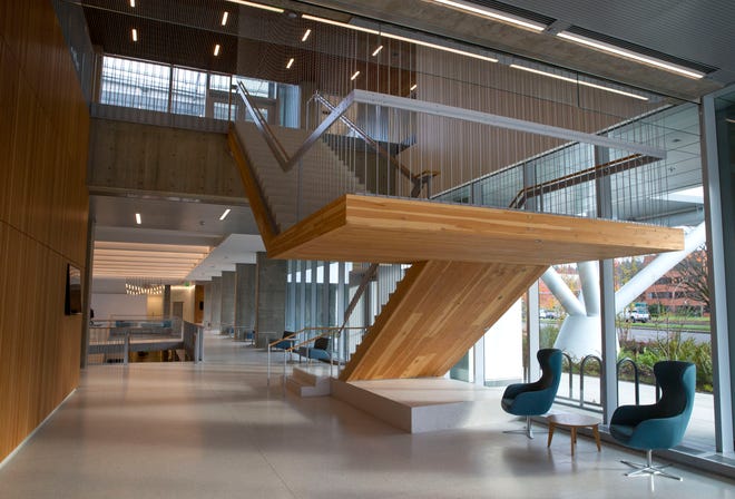 The west stair and lobby entrance of The Phil and Penny Knight Campus for Accelerating Scientific Impact. Mass timber, a category of wood construction material that can replace steel and concrete for primary load-bearing functions, was used in the Knight science building on the UO campus.