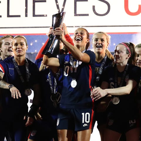 U.S. women's national soccer team players hoist th