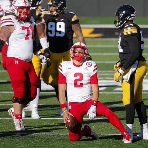 Nebraska quarterback Adrian Martinez reacts after 