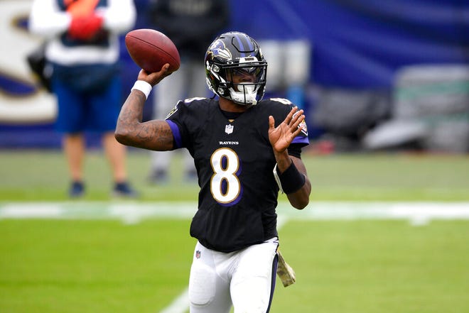 Baltimore Ravens quarterback Lamar Jackson throws a pass against the Tennessee Titans during the first half of an NFL football game, Sunday, Nov. 22, 2020, in Baltimore. (AP Photo/Nick Wass)
