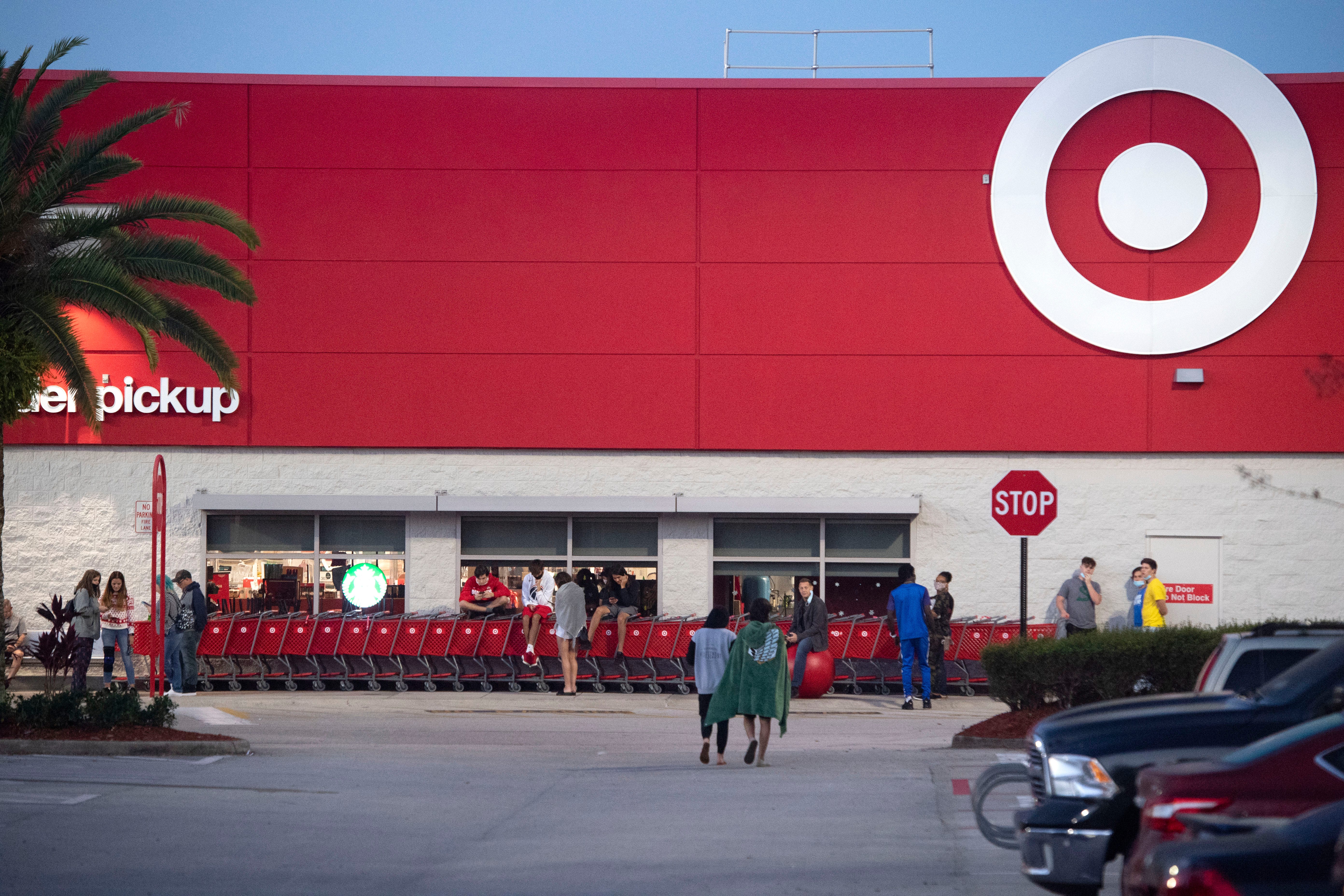 At least 100 shoppers wait in line and enter Target when the doors opened at 7 a.m. on Black Friday, Nov. 27, 2020, at the store in Martin County. Discounts on electronics, kitchen tools and toys were among the top deals offered. 