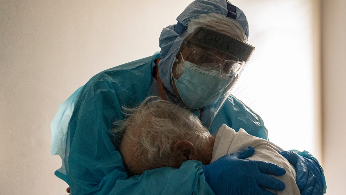 Dr. Joseph Varon hugs and comforts a patient in the COVID-19 intensive care unit (ICU) during Thanksgiving at the United Memorial Medical Center on November 26 in Houston, Texas.