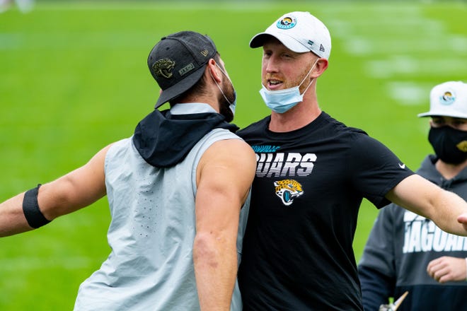 Jacksonville Jaguars quarterback Mike Glennon (2) chest bumps with his teammates before the Jaguars vs. Browns game at TIAA Bank Field in Jacksonville, FL on Sunday, November 29, 2020.
