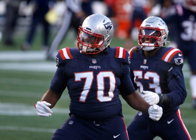 New England defense lineman Adam Butler celebrates bringing down Arizona quarterback Kyler Murray for a sack on Nov. 29, 2020. Butler will most likely hit the free agent market on Wednesday.