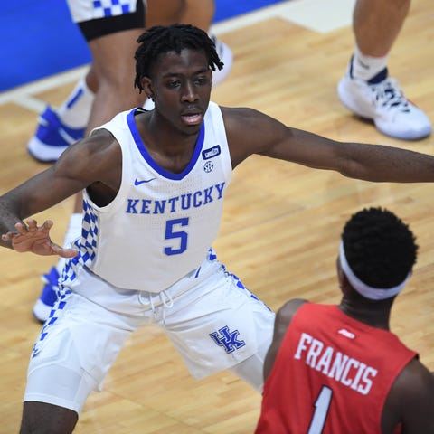 UK guard Terrence Clarke defends the ball during t