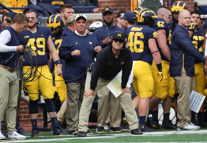 Michigan coach Jim Harbaugh watches the game against Penn State on Saturday.