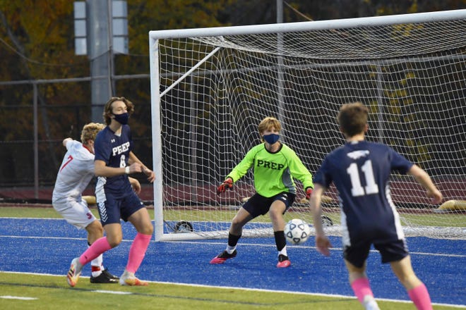 A towering presence along the Eagles’ last line of defense in front of the goal this fall, Marblehead resident and Prep senior David Armini (6) seals off an attacker to give the St. John’s keeper a clear path to a ball in the box.