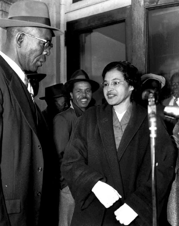 Mrs. Rosa Parks and E.D. Nixon, left, former president of the Alabama NAACP, arrive at court in Montgomery March 19, 1956 for the trial in the racial bus boycott.  Mrs. Parks was fined $14 on Dec. 5 for failing to move to the segregated section of a city bus.  The boycott started on the day she was fined.  There were 91 other defendants. (AP Photo/Gene Herrick)