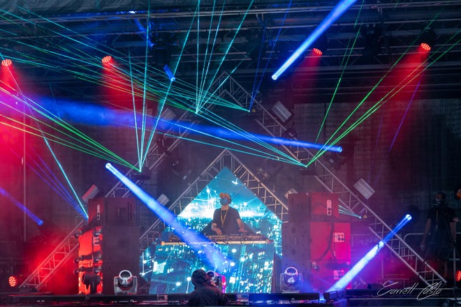 A DJ entertains at a "vertical concert" in October at the Bahia Mar Fort Lauderdale Beach hotel in South Florida. The company that pioneered the new concept will be presenting a New Year's Eve show for guests at the Hilton Daytona Beach Oceanfront Resort.