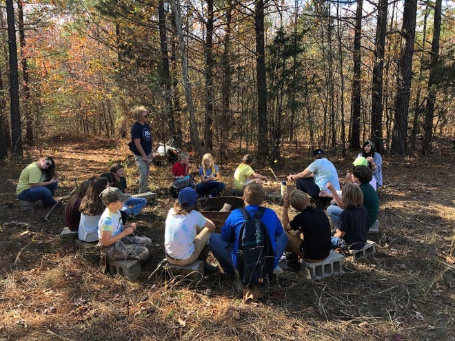 Students of Clarksville's Amare Montessori school gather for an outdoor lesson this fall, on the site of the new Amare school coming to Sango.