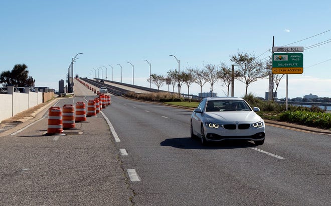 Motorists travel across the Bob Sikes Bridge on Wednesday, Dec. 2, 2020. The Tourism Development Commission wants an audit of the fees collected at the toll plaza and an accounting of those dollars. 