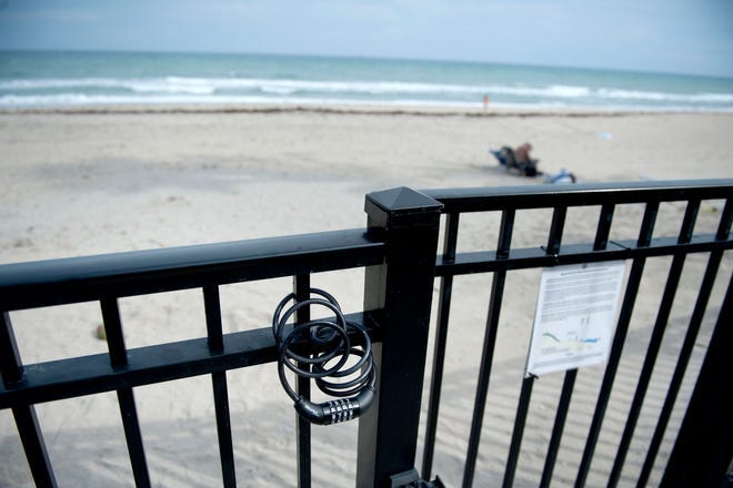 The Dunbar Road beach access gate in Palm Beach is closed at night. The beach is closed from sunset to sunrise. MEGHAN MCCARTHY / PALM BEACH DAILY NEWS