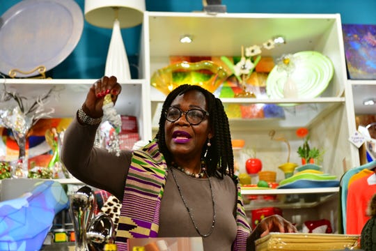Rachael A. Woods, owner of ArtLoft in Detroit, makes a presentation from inside her store during a Dish and Design event held online, December 2, 2020.