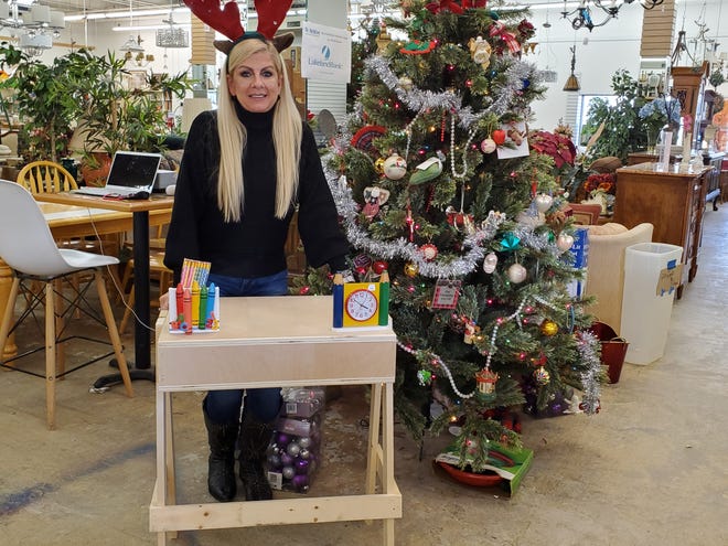 Bergen ReStore Director Teri Capparelli with one the first completed Desks 4 Homes.
