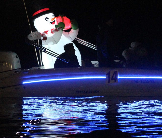 New Bern Parks and Recreation presents the 36th annual Coastal Christmas Flotilla at Union Point Park in New Bern, NC, Dec. 5 2020. The colorful event features decorated yachts and lighted boats with holiday spectators gathering along the Trent and Neuse Rivers to view the parade. [Gray Whitley / Sun Journal Staff]