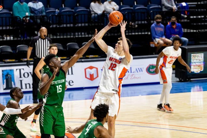 Florida forward Colin Castleton shoots a mid-range jumper in the first half Sunday against Stetson in Exactech Arena at the O'Connell Center.