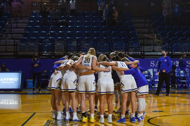 The South Dakota State women's basketball team huddles up in front of empty seats before playing Gonzaga on Sunday, December 6, at Frost Arena in Brookings.