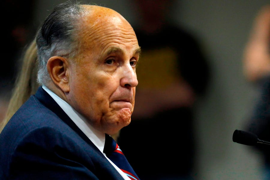 Rudy Giuliani, personal lawyer of President Donald Trump, looks on during an appearance before the Michigan House Oversight Committee in Lansing, Michigan on Dec. 2, 2020.