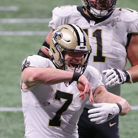 Taysom Hill of the New Orleans Saints celebrates h