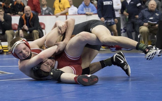 Freedom's Trent Schultheis (in red) is hoping to become the 28th wrestler to win four WPIAL titles.
