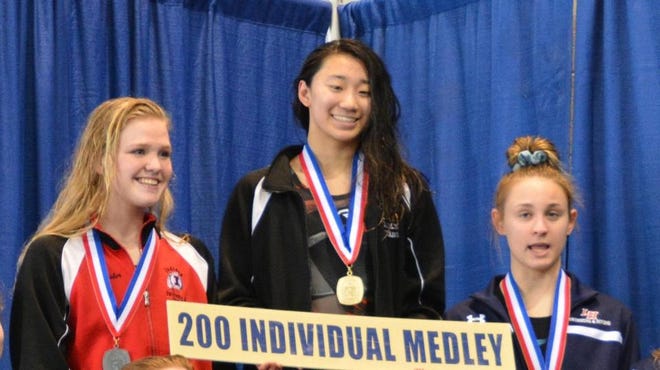 Sewickley Academy's Isabel Huang, center, has won back-to-back WPIAL titles in the 200 individual medley and 100 backstroke while swimming for Quaker Valley.