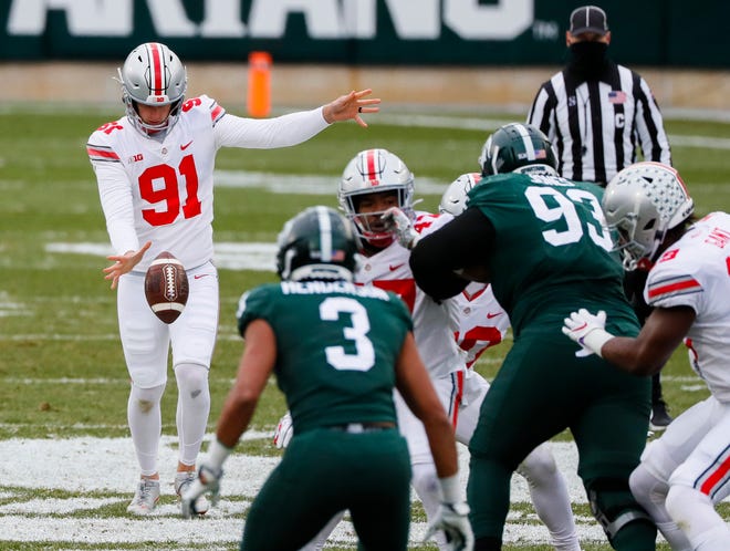 Ohio State Buckeyes punter Drue Chrisman (91) punts the ball during the second quarter of a NCAA Division I football game between the Michigan State Spartans and the Ohio State Buckeyes on Saturday, Dec. 5, 2020 at Spartan Stadium in East Lansing, Michigan.