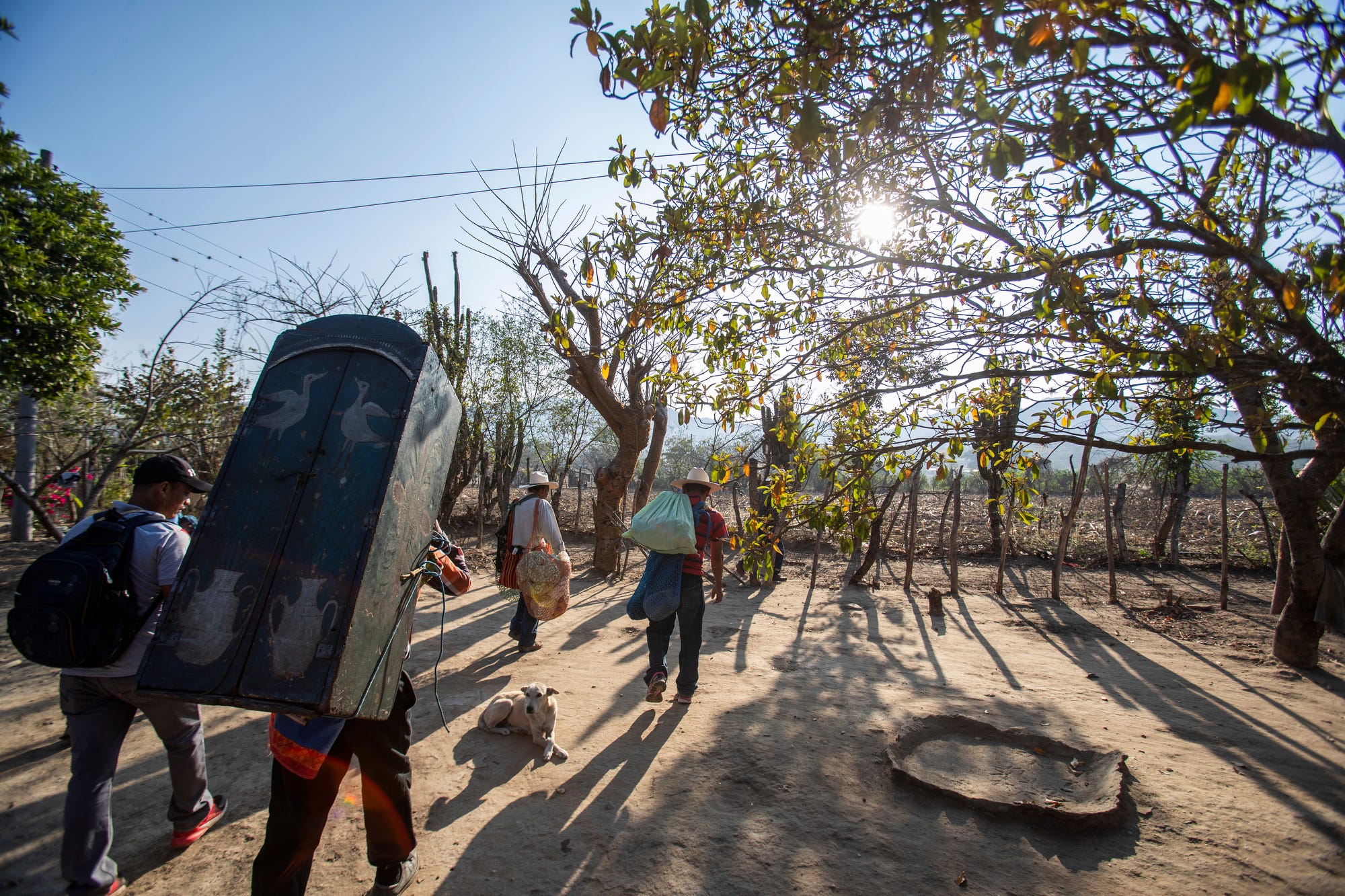 Members of the Achi community in Baja Verapaz, Guatemala, visit Francisco Sical's home seeking a donation for the patron saint of the village in early March 2020.