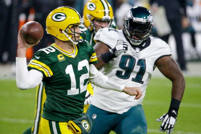 Green Bay Packers' Aaron Rodgers throws during the second half of an NFL football game against the Philadelphia Eagles Sunday, Dec. 6, 2020, in Green Bay, Wis. (AP Photo/Mike Roemer)