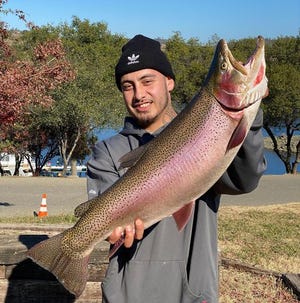 Robert Flores bagged this 13.8-pound cutbow at Lake Amador while casting a blue/silver Kastmaster at the corner of the dam on Dec. 3.