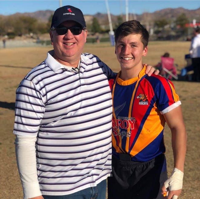 Stacy Huntington and Tyler Rascon at a rugby game.