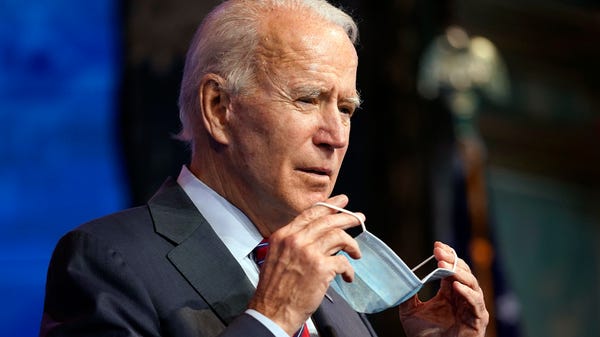 President-elect Joe Biden puts on his face mask af