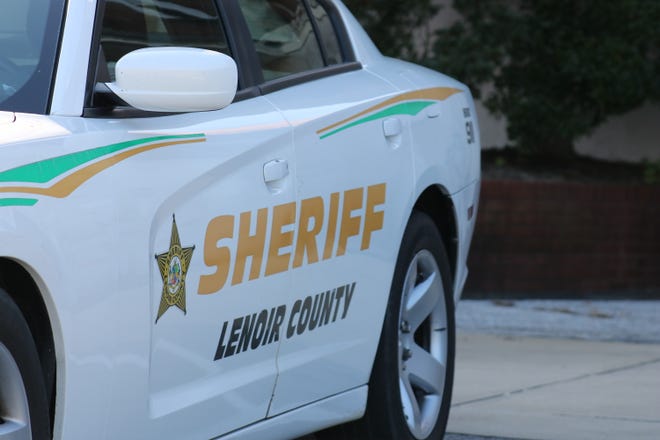 A Lenoir County Sheriff's Office vehicle is parked outside the Lenoir County Courthouse.