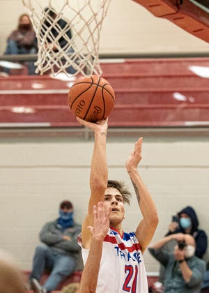 Zane Trace senior Trey Miller makes a three-point jump shot during the second half of Zane Trace’s game against Vinton County on Tuesday, Dec. 8, 2020. Miller had 11 points for the night to help Zane Trace defeat Vinton 53-44. 