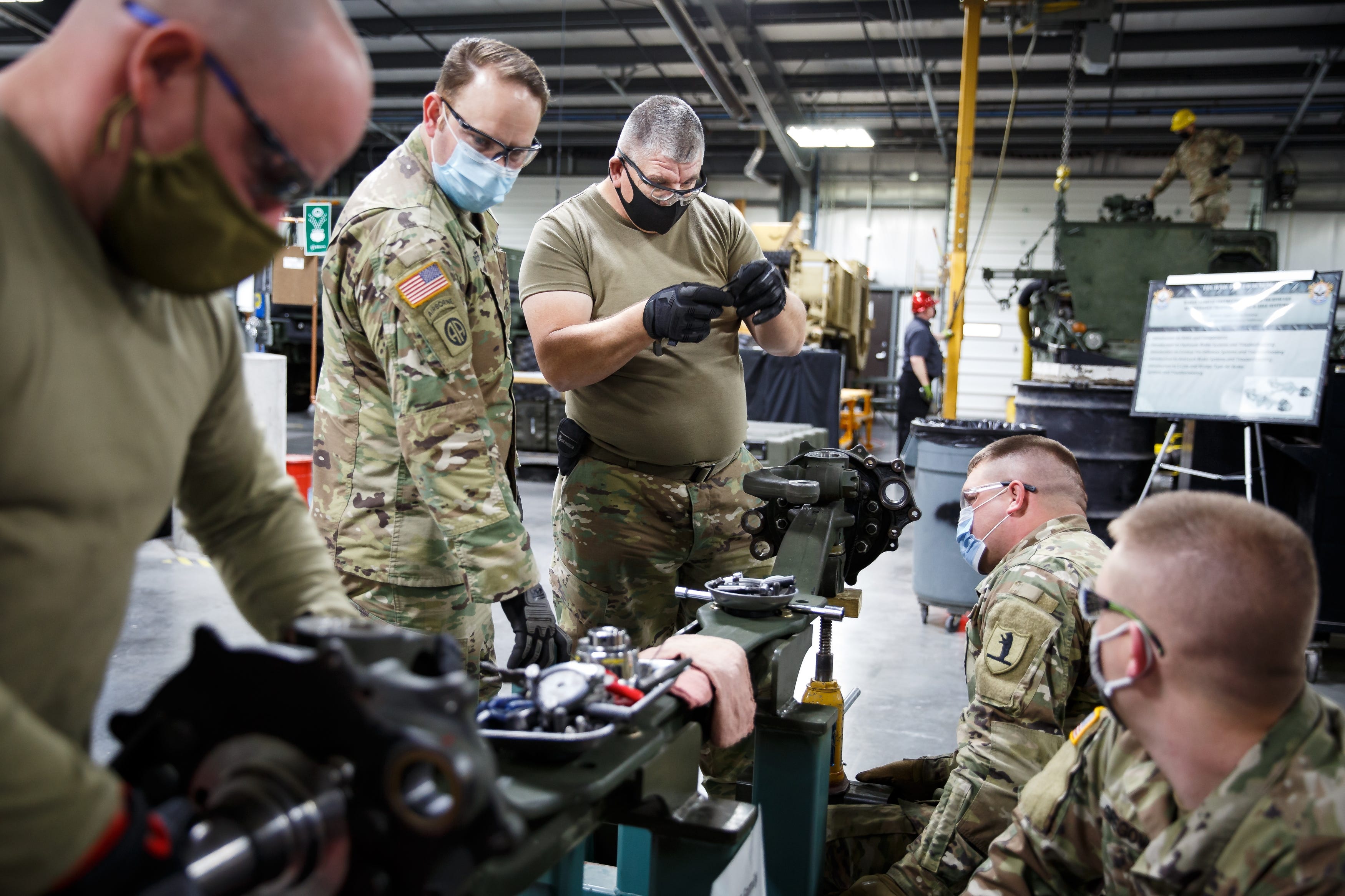 4:03 p.m. JOHNSTON - SSG Gary Buford of Bells, TN, center, trains at the Sustainment Training Center on Camp Dodge on Tuesday, Dec. 8, 2020, in Johnston, IA. Soldiers from across the country come to the STC to train on maintenance, logistics and medical practices they can't get anywhere else. Trainings were suspended in March but resumed in June with the addition of temperature checks, masks, a questionnaire and frequent sanitation around the base. "It's like wearing a (armored) vest overseas," MAJ Sterling Montgomery said of wearing a mask, "you just get used to it."