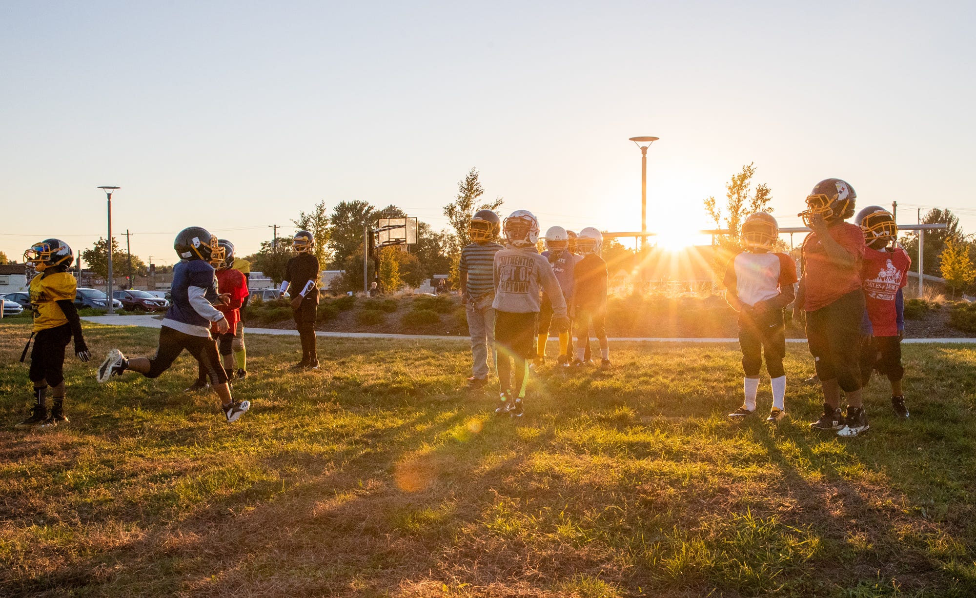 The Indy Steelers practice as the sun sets at Tarkington Park, where the team's practice field is located, in Indianapolis. "Tarkington side, you can go right around the corner and it'll be shootings, robberies, you'll hear police sirens," said Donnell Hamilton, who grew up in the Butler-Tarkington neighborhood and founded the Indy Steelers 15-years ago. "It's a bit more of a struggling side. Some people wouldn't understand what some of these kids are going through. Some people are really hungry out here. It's a lot going on out here, it's a lot." Former Indy Steeler player Jay Roberts, who now plays for a local high school team, says the program needs to stay around as long as it can. "They're not just at home bored, they're not seeing what's going on in their environment," he said. "They get a chance to take two hours out of their lives to have fun."