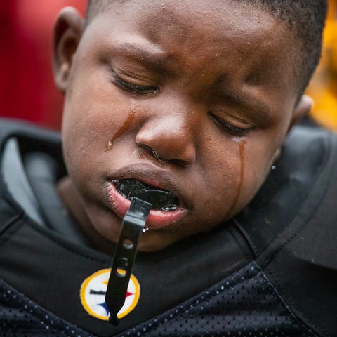 Tyson Delaney, 8, cries after the Indy Steelers' 8