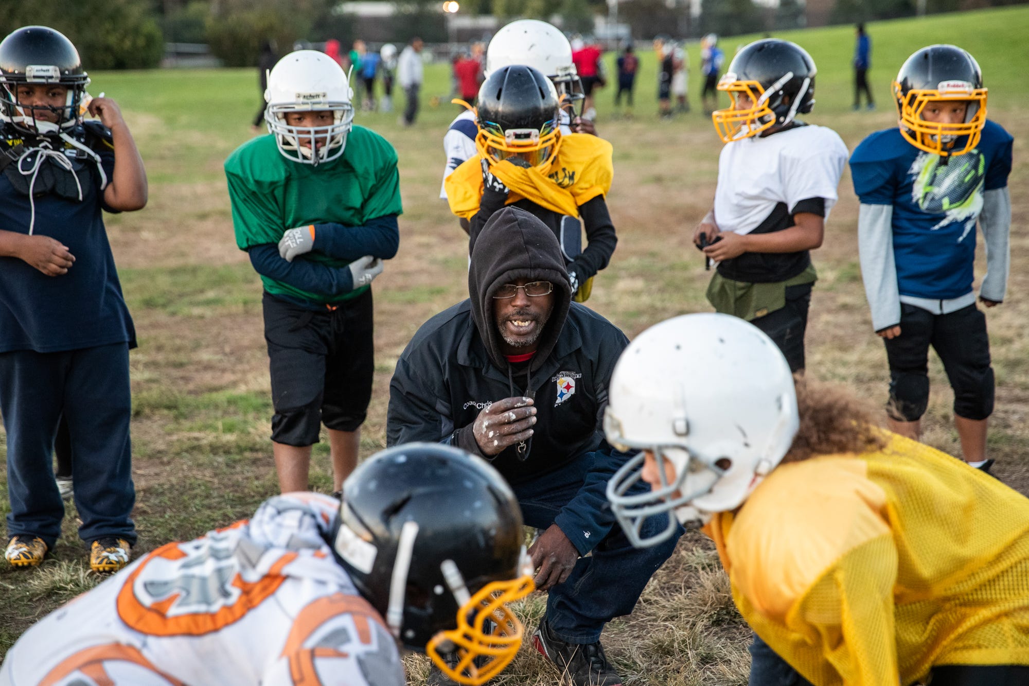 Indy Steelers coach Chris Meriweather lines two players during a drill at Tarkington Park. After Coach Nell's death, one question was how the remainder of the coaching staff could carry the team forward.