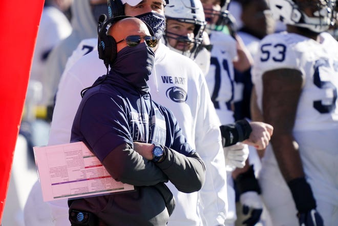 Penn State head coach James Franklin watches from the sideline during the second half of an NCAA college football game against Michigan, Saturday, Nov. 28, 2020, in Ann Arbor, Mich. (AP Photo/Carlos Osorio)