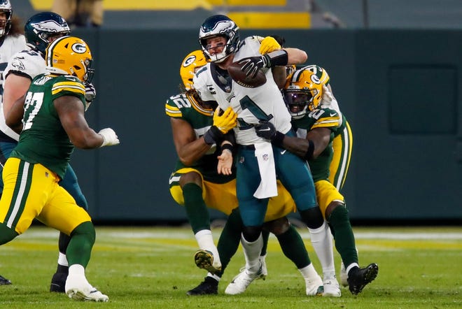 Philadelphia Eagles' Carson Wentz is sacked during the second half of an NFL football game against the Green Bay Packers Sunday, Dec. 6, 2020, in Green Bay, Wis. (AP Photo/Matt Ludtke)