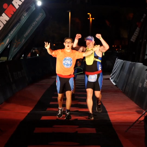 21-year-old Chris Nikic crosses the finish line at