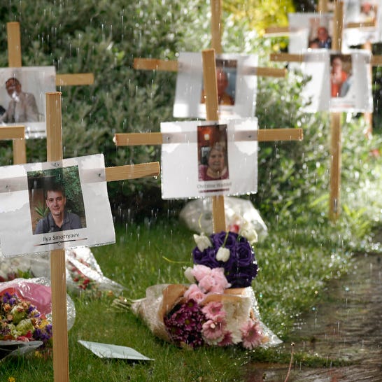 Photographs and memorials for those who died during the lockdown sit outside Riverside Church on April 30, 2020 in Burton-on-Trent, England. 