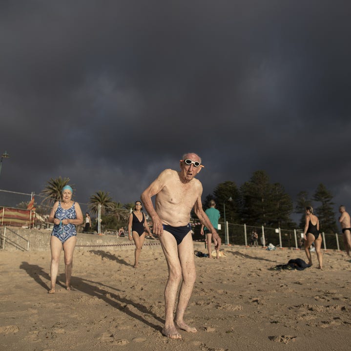 Swimmers walk into the water as Bronte Beach is reopened on April 28, 2020 in Sydney, Australia. 