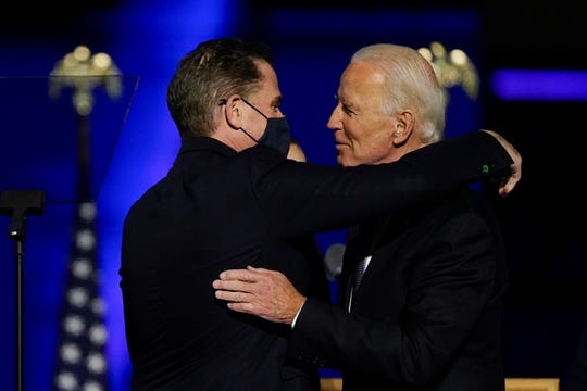 President-elect Joe Biden hugs his son Hunter Biden on stage Nov. 7, 2020, in Wilmington, Del.