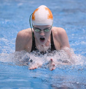 Marlington freshman Claire Cox swims breaststroke for the Dukes' 200 medley relay at the Northeast Division II District Swim Meet,  Feb. 14, 2020. (CantonRep.com / Ray Stewart)