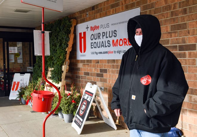 A Salvation Army bell ringer accepts donations on Wednesday, December 10, at HyVee on 10th Street in Sioux Falls.